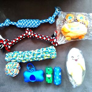 NEW: 9 Piece Set of Dog Toys, Poop Bags and Dispenser with Clip